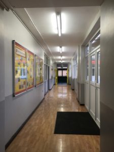 Smart sensors in a Liverpool school corridor measures ambient light and movement and adjusts accordingly.