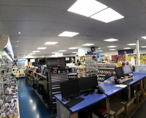 LED lighting gives energy and costs savings for Bennetts Car Parts shop in London, East England.