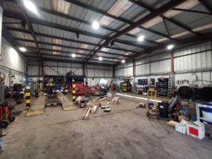 Replacement workshop lighting installation for H Gittins Transport in Bromsgrove, Worcestershire.