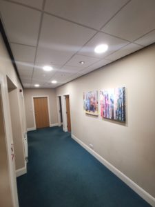 Clean LED lighting with smart sensors are ideal for internal office corridors without no natural light.