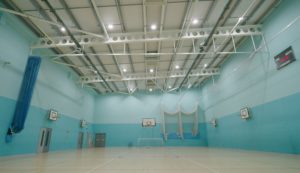 Replacement LED lighting for a school sports hall at Manchester Communication Acedemy.