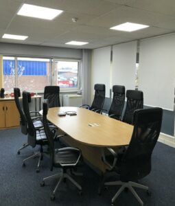 Meeting room at Feed the Hungry UK in Coventry benefits from LED lighting ceiling panels.