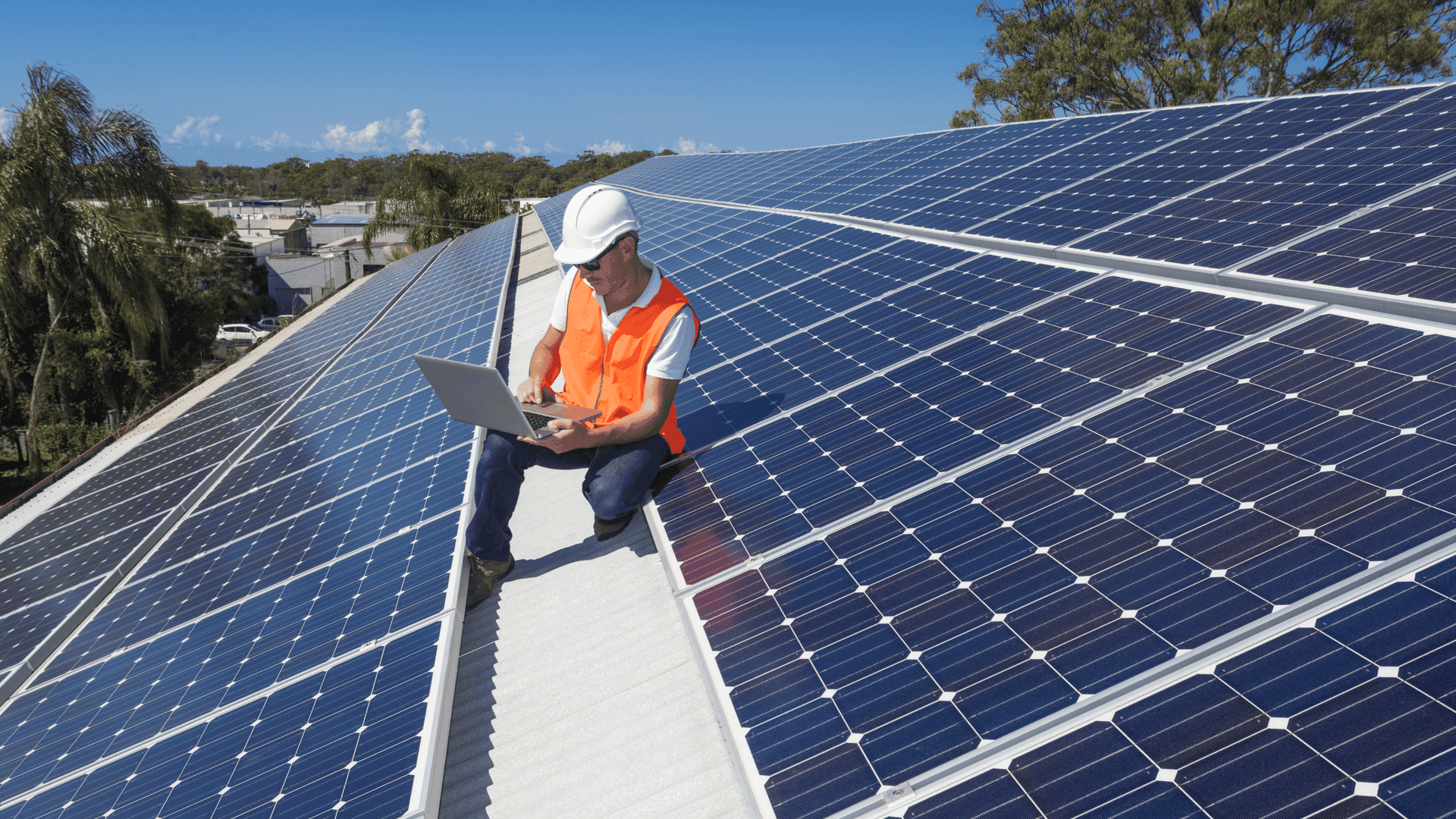 Engineer on Roof Moniroting Solar Panels